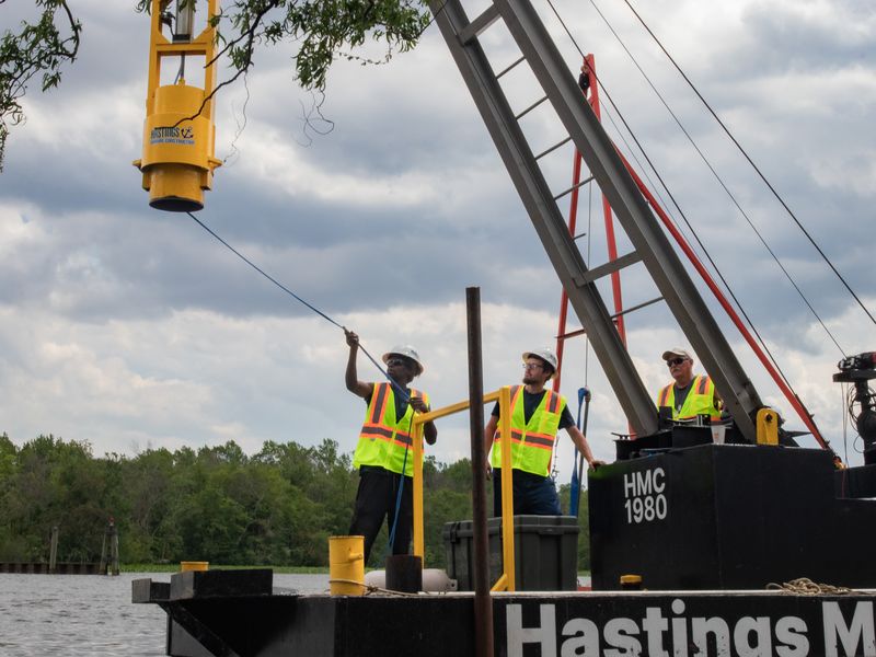 The crew driving pile from the Hastings Marine Construction barge