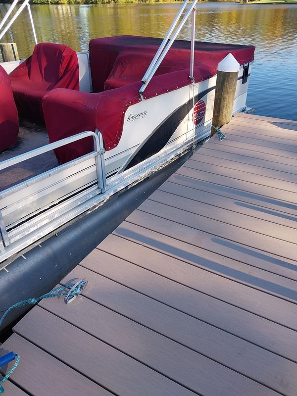 Cleats, piling caps and a pontoon tied alongside