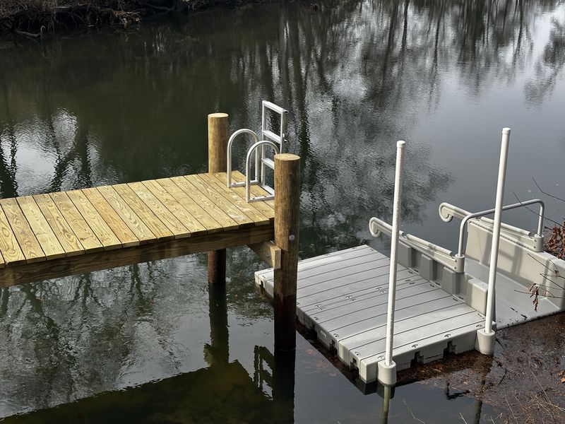 Floating launch with guide posts and an aluminum ladder