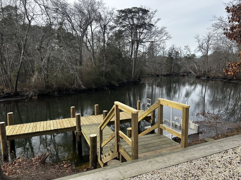 Access steps down to a pier and floating launch