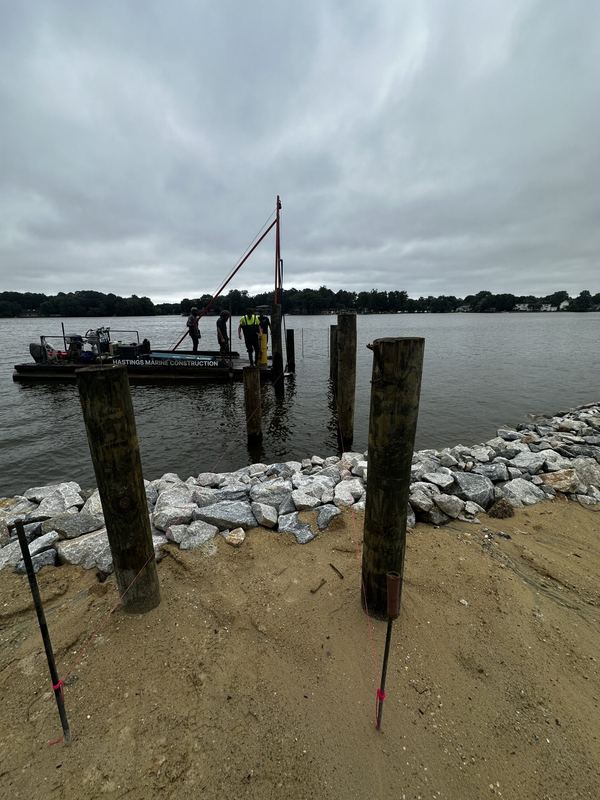 Shoreline rip-rap revetment, stone boat ramp and new pier and dock